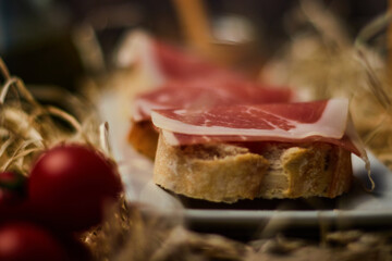 local products Still life of Serrano ham with tomatoes and olive oil