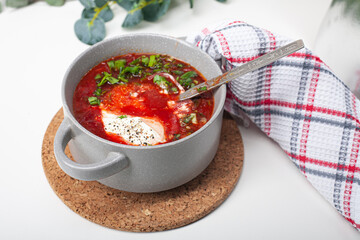 Red borsch on a light background. Borsch - beetroot soup, traditional dish of russian cuisine. The view from the top.