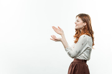 pretty emotional woman gesturing with her hands in formal suit cropped view studio