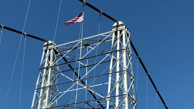 Flag of USA on top of suspension of Royal Gorge Bridge, Colorado