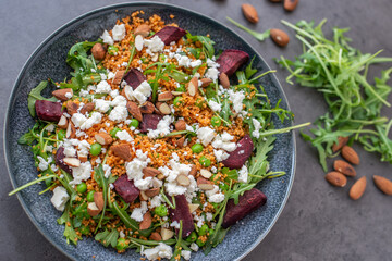 healthy home made couscous salad with sweet potato, beetroot and feta cheese