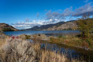 Fototapeta na wymiar Scenic view of Okanagan Lake and blue sky in autumn in Penticton, BC, Canada