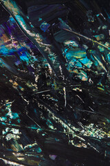 colorful creative motley background: smudged residues of oil paints on a wooden palette, short...
