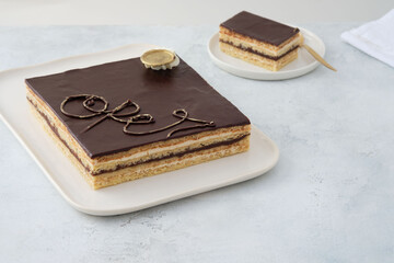 Opera cake is a type of almond sponge cake with a coffee and chocolate filling.