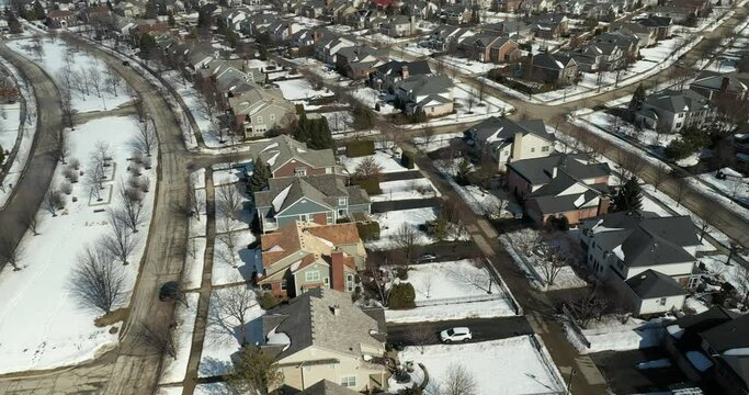 Aerial view of an upscale neighborhood in suburban Chicago during winter.