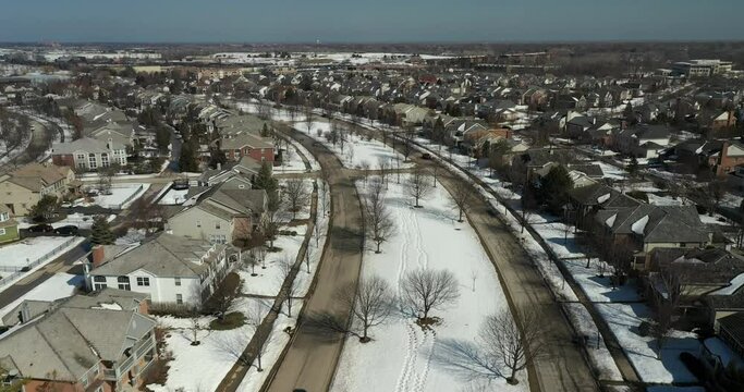 Aerial view of an upscale neighborhood in suburban Chicago during winter.