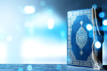 Quran and prayer beads on the table