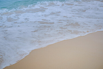 Fototapeta na wymiar Soft wave on beach. Selective focus. wallpaper and background texture.