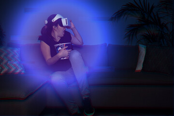 Obraz na płótnie Canvas Woman watching movie at home using vr headset