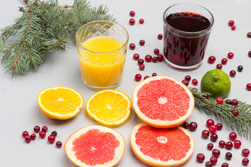 Fototapeta na wymiar Cranberry and orange drinks in glasses.