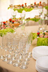 Empty glasses set, Elegant table setting for a festive dinner in the restaurant. Snacks on the buffet table