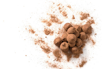 chocolate truffles covered with cocoa isolated on white background, selective focus