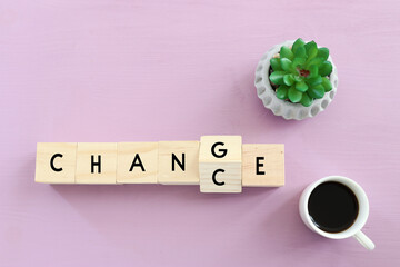 top view image of wooden cube flip with word change to chance, concept of mindset change, personal development and growth