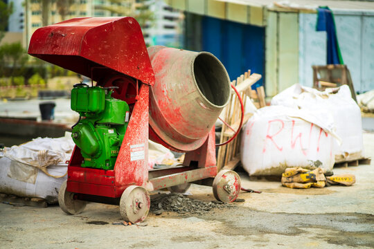 Kuala Lumpur, Malaysia - January 22, 2021: concrete mixer with sand and stones in the construction site.