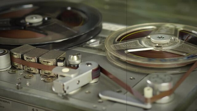 Old vintage reel-to-reel player. Tape recorder with spools. Bobbin tape recorder.	
