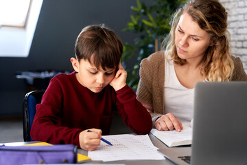 Fototapeta premium Boy having problems in finishing homework