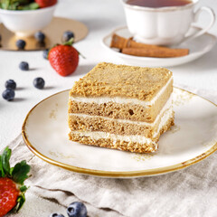 Delicious cake with fruits on background