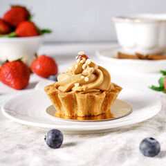 Delicious cake with fruits on background