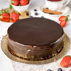 Delicious cake with fruits on background