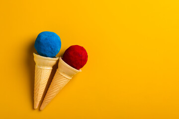 colors in shapes of ice cream scoops in cones for Indian holi festival