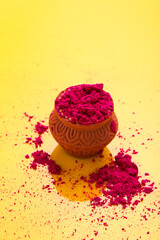 Indian festival holi : Red color in wooden clay bowl