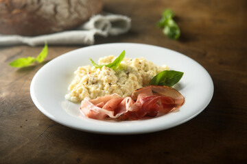 Homemade scrambled eggs with smoked ham