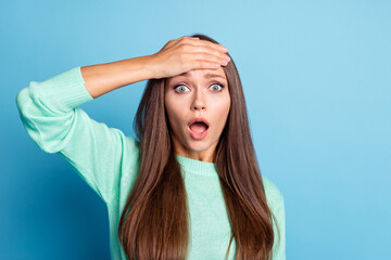 Portrait of worried brown-haired girl touching forehead diagnosis migraine therapy isolated over bright blue color background