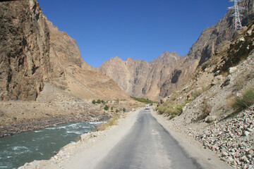Pamir highway M41 international roa or pamirskij trakt. Panj river and Pamir mountains. Panj is upper part of Amu Darya river. Panoramic view.Tajikistan and Afghanistan border, Gorno-badakhshan region