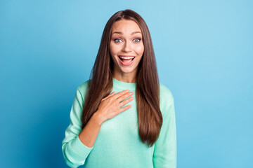 Portrait of charming delighted cheerful brown-haired girl got good news reaction luck isolated on bright blue color background