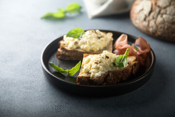 Homemade scrambled eggs with smoked ham