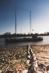 Obraz premium chain shore boat river destination travel