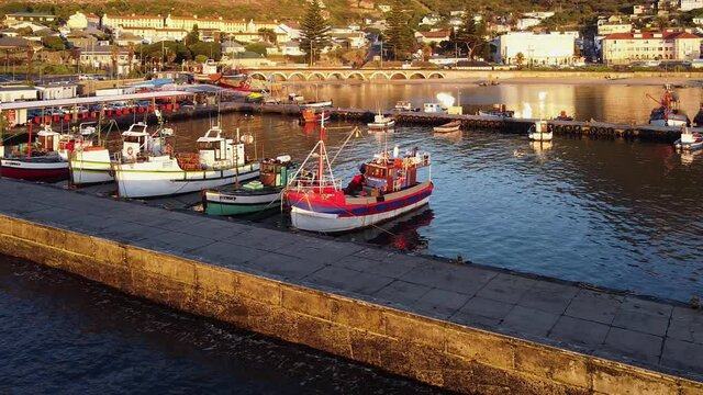 Fishing boats moored in Kalk Bay harbor