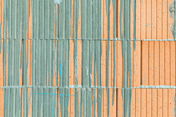 background of red brick with dried flowing concrete pattern