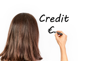 Woman executive writing the words Credit and the Euro symbol, €