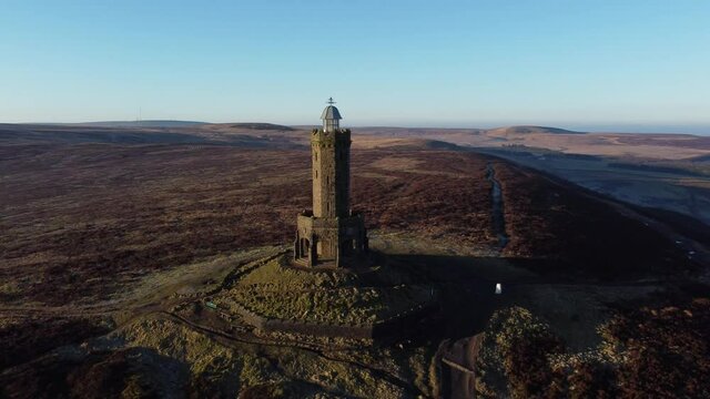 Darwen Jubilee tower Lancashire hillside misty valley moorland countryside aerial left orbit wide