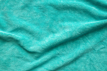 Green towel fabric texture surface close up background