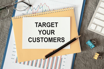 Target your Customers is written in a document on the office desk