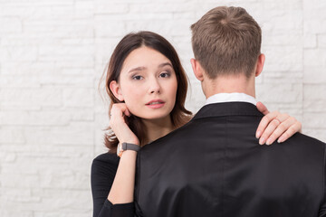 A young woman and young men in a romantic photo session, their love story.