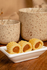 Close-up of delicious homemade pineapple roll tart for eid fitr on a with plate