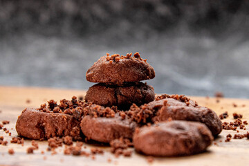 Delicious homemade chocolate cookies on a wooden plate