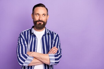 Photo of calm mature man cross hands look empty space isolated over purple color background