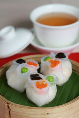 traditional Cantonese shrimp dumpling Dim sum called Har Gow or Hagao in bamboo basket