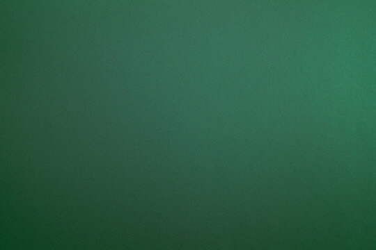 Colored Green background. Paper, cardboard background. High resolution paper texture.