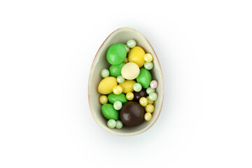 Half of chocolate egg with candies isolated on white background