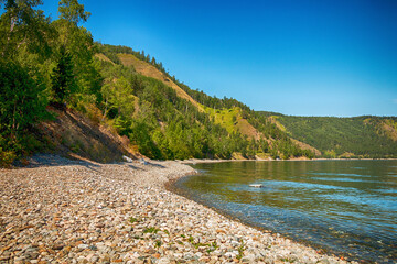 Fototapeta premium Beautiful natural summer landscape. Mountains, sky, water. Lake Baikal.