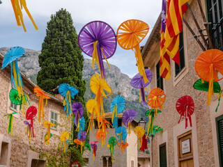 houses in the city of Deia at times of celebration are decorated in the streets with colorful art made by the villagers, majorca, spain