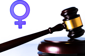 Judge mallet and gender symbol on white background