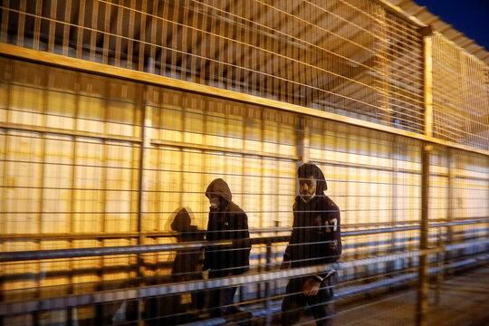 Palestinian laborers head to workplaces in Israel, in Qalqilya