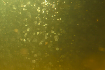 Abstract glitter gold bokeh