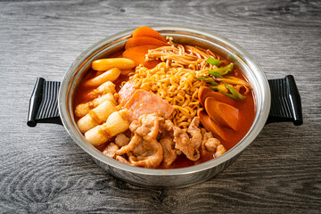 Budae Jjigae or Budaejjigae (Army stew or Army base stew). It is loaded with Kimchi, spam, sausages, ramen noodles and much more